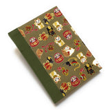 This beautifully handcrafted journal features a traditional Japanese Maneki Neko (lucky cat) and Daruma doll pattern on a high-quality fabric cover, symbolizing prosperity and good fortune. Designed for cat lovers, writers, and creatives, this unique notebook is perfect for journaling, sketching, or note-taking, making it a meaningful and stylish gift.
