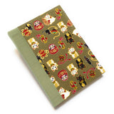 This beautifully handcrafted journal features a traditional Japanese Maneki Neko (lucky cat) and Daruma doll pattern on a high-quality fabric cover, symbolizing prosperity and good fortune. Designed for cat lovers, writers, and creatives, this unique notebook is perfect for journaling, sketching, or note-taking, making it a meaningful and stylish gift.