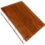 A handcrafted Lychee wood Coptic journal featuring a smooth, polished wooden cover with warm reddish-brown tones. The exposed Coptic stitch allows the journal to lay completely flat, making it perfect for writers, artists, and journal enthusiasts. The high-quality paper inside is ideal for sketching, note-taking, or creative journaling. A unique, durable, and elegant notebook designed for those who appreciate fine craftsmanship and timeless design.