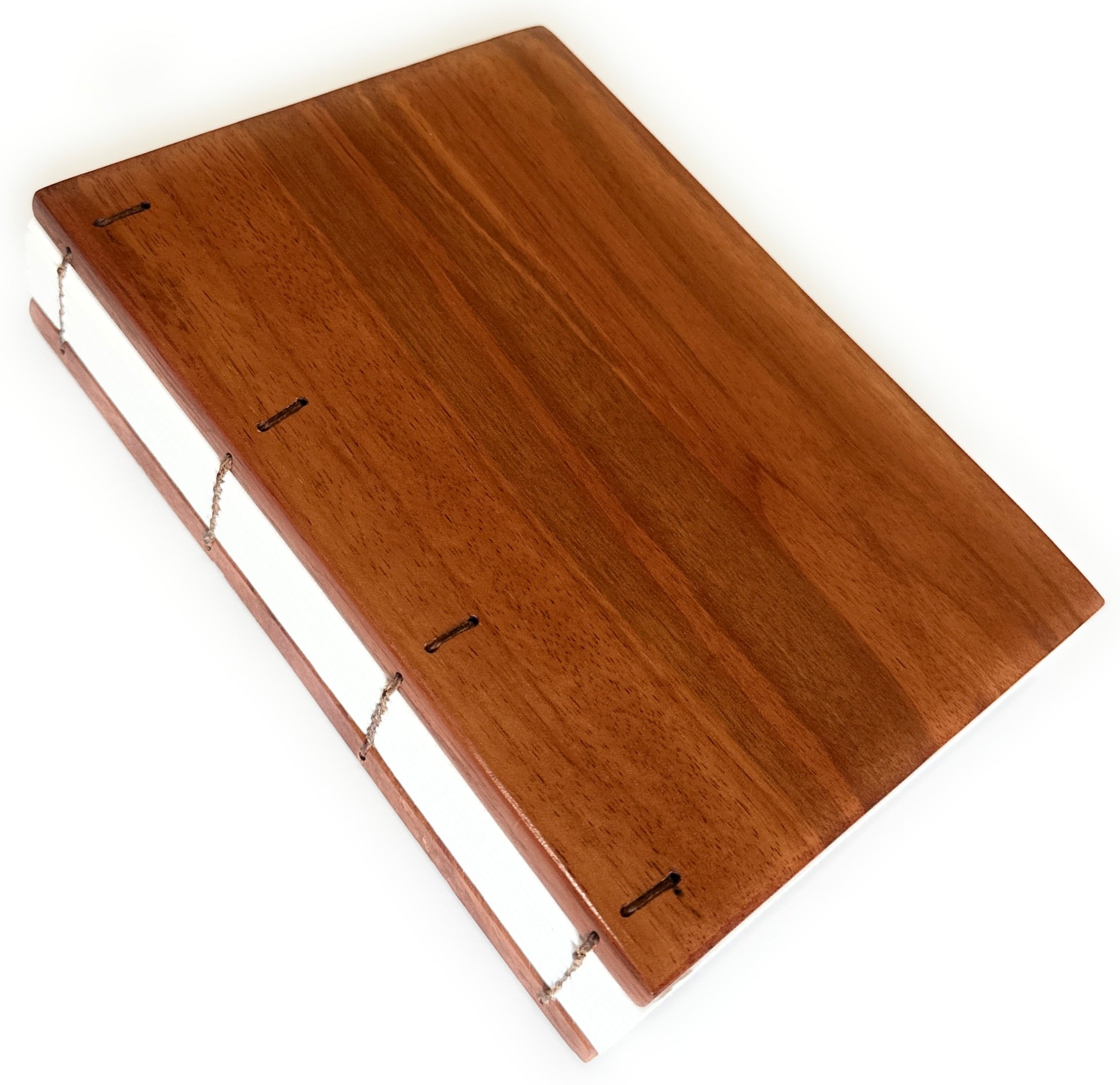 A handcrafted Lychee wood Coptic journal featuring a smooth, polished wooden cover with warm reddish-brown tones. The exposed Coptic stitch allows the journal to lay completely flat, making it perfect for writers, artists, and journal enthusiasts. The high-quality paper inside is ideal for sketching, note-taking, or creative journaling. A unique, durable, and elegant notebook designed for those who appreciate fine craftsmanship and timeless design.