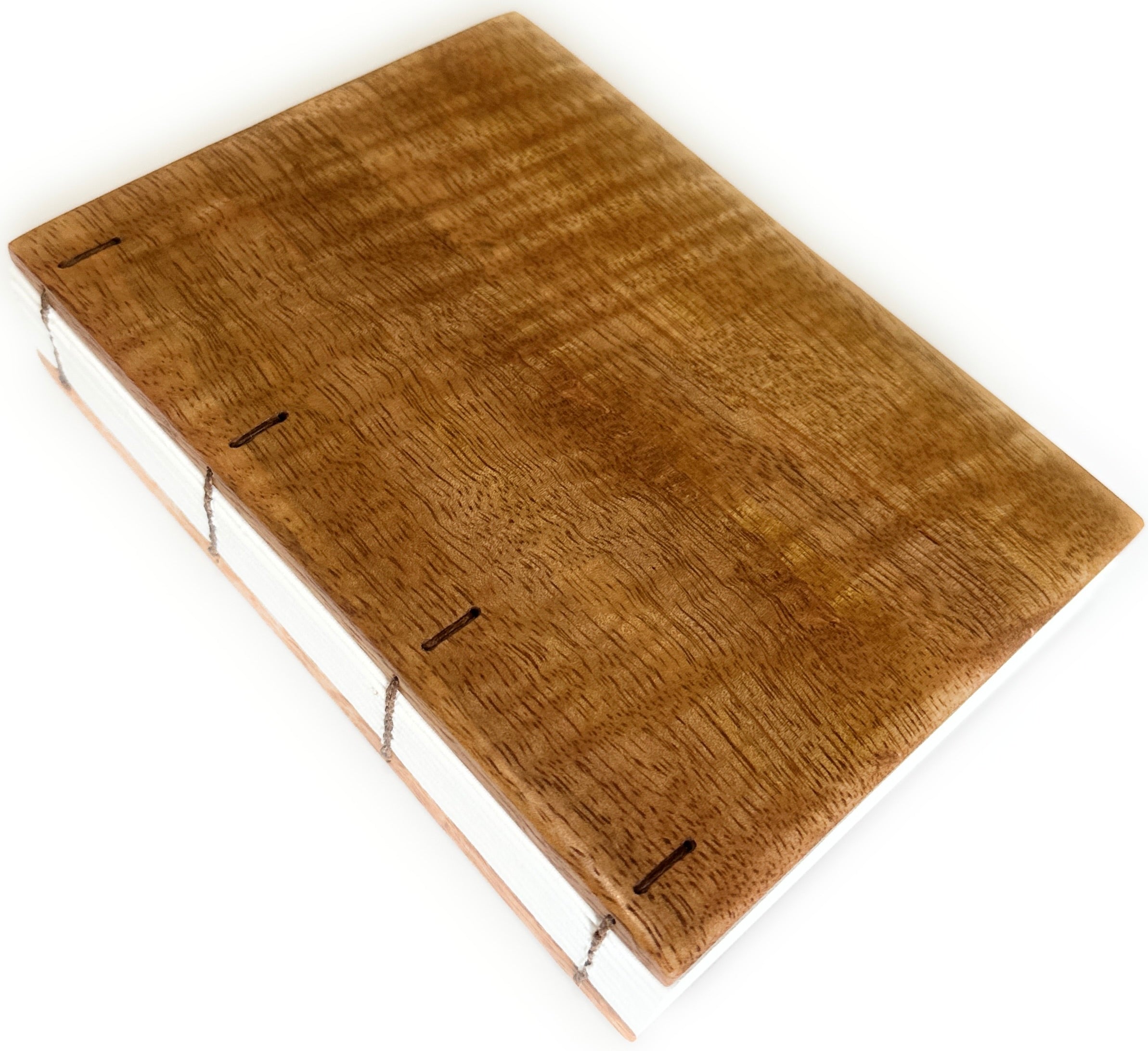 The Mango Wood Coptic Journal features a beautifully handcrafted wooden cover made from rich, warm-toned mango wood, showcasing natural grain patterns. The exposed spine  allows the journal to lay flat when open, making it an excellent choice for writers, artists, and journal enthusiasts seeking a durable, one-of-a-kind notebook.