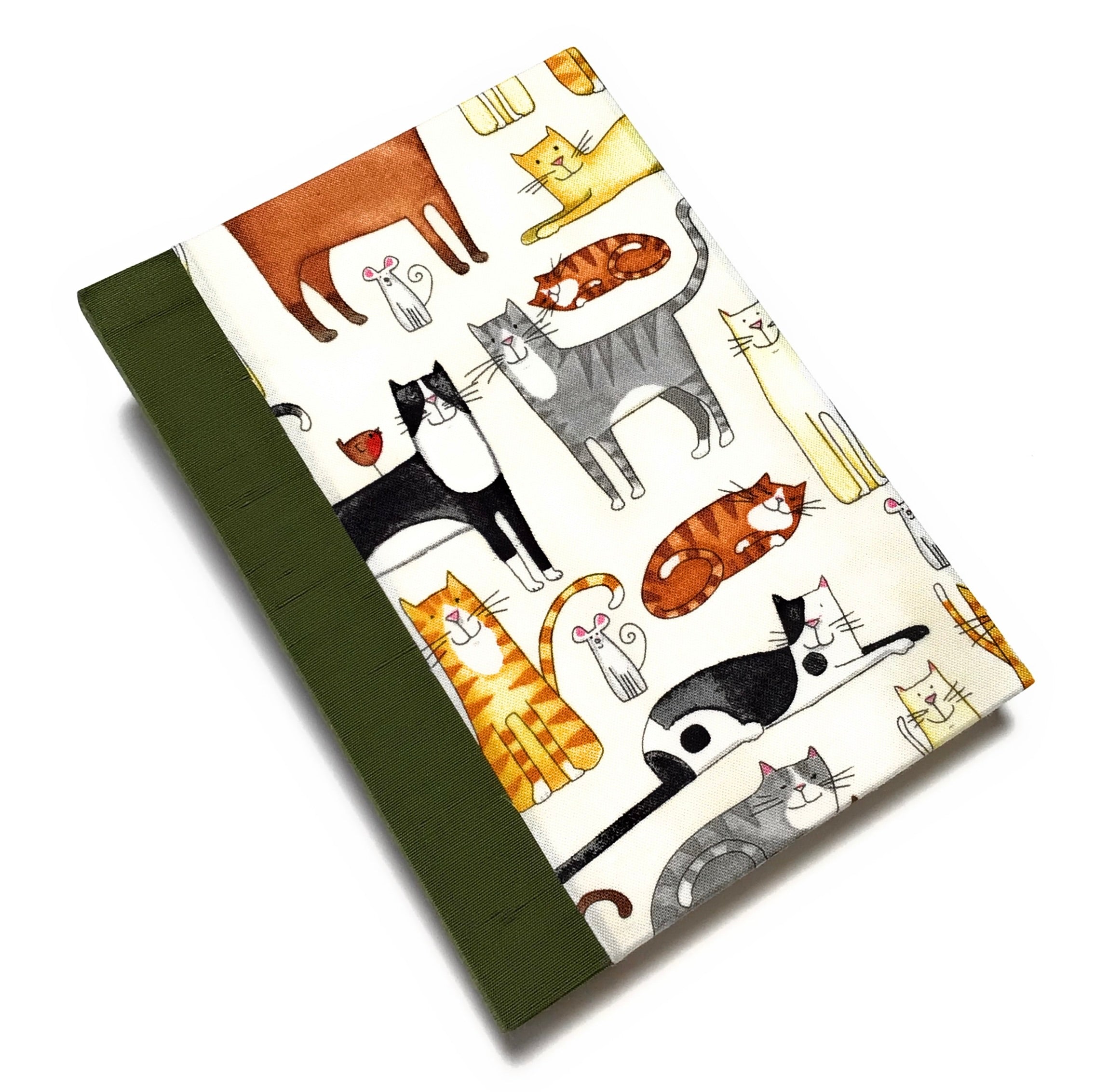 This handmade journal features a delightful fabric cover adorned with playful illustrated cats in various poses, making it a perfect notebook for cat lovers. Bound with a durable moss green spine and filled with high-quality blank pages, it's an ideal choice for journaling, sketching, or note-taking with a touch of feline charm.