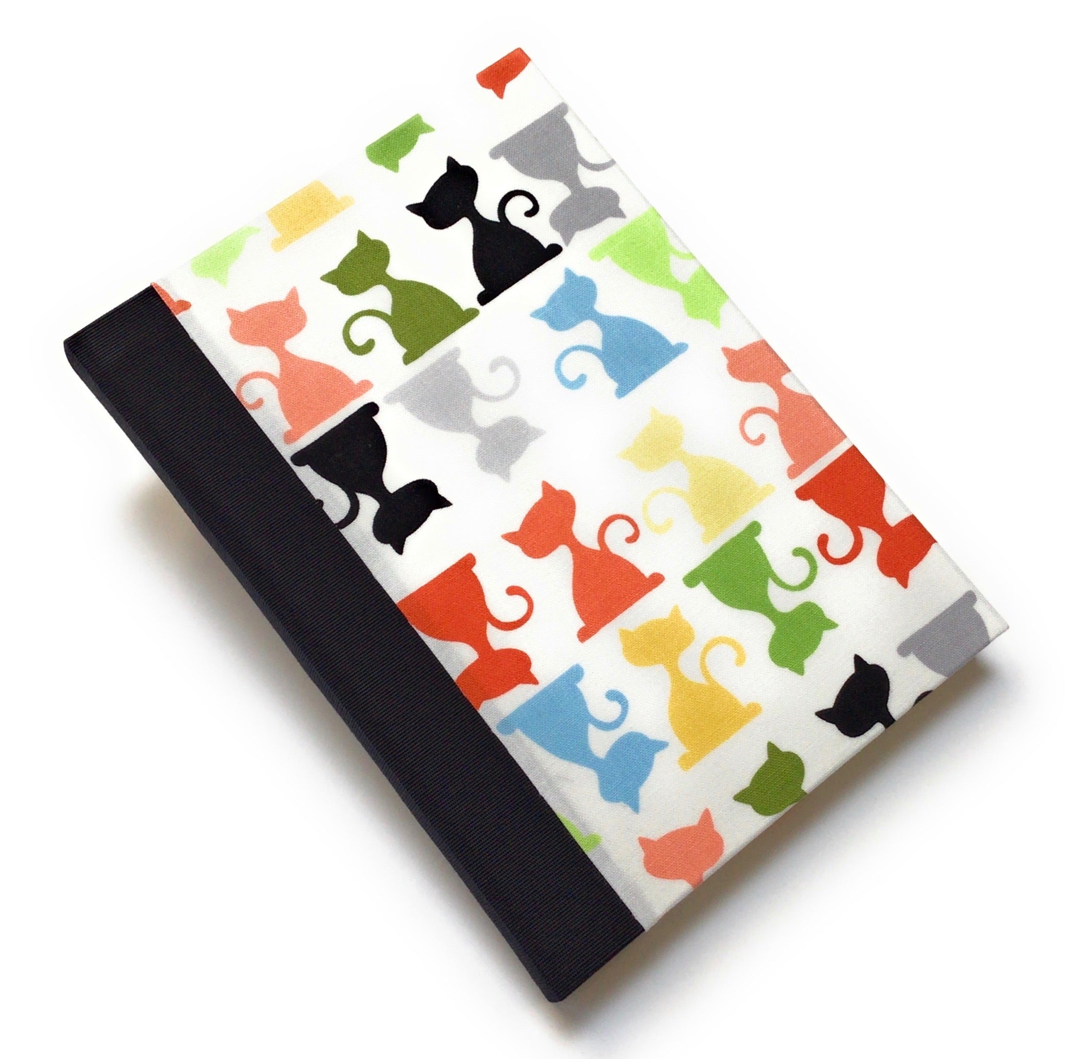 This handcrafted cat journal features a vibrant and playful fabric cover adorned with multicolor feline silhouettes, making it a perfect gift for cat lovers, writers, and artists. Bound with black bookbinding cloth and high-quality materials, this unique notebook is ideal for journaling, sketching, or note-taking.