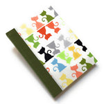 This handcrafted cat journal features a vibrant and playful fabric cover adorned with multicolor feline silhouettes, making it a perfect gift for cat lovers, writers, and artists. Bound with sage green bookcloth and high-quality materials, this unique notebook is ideal for journaling, sketching, or note-taking.