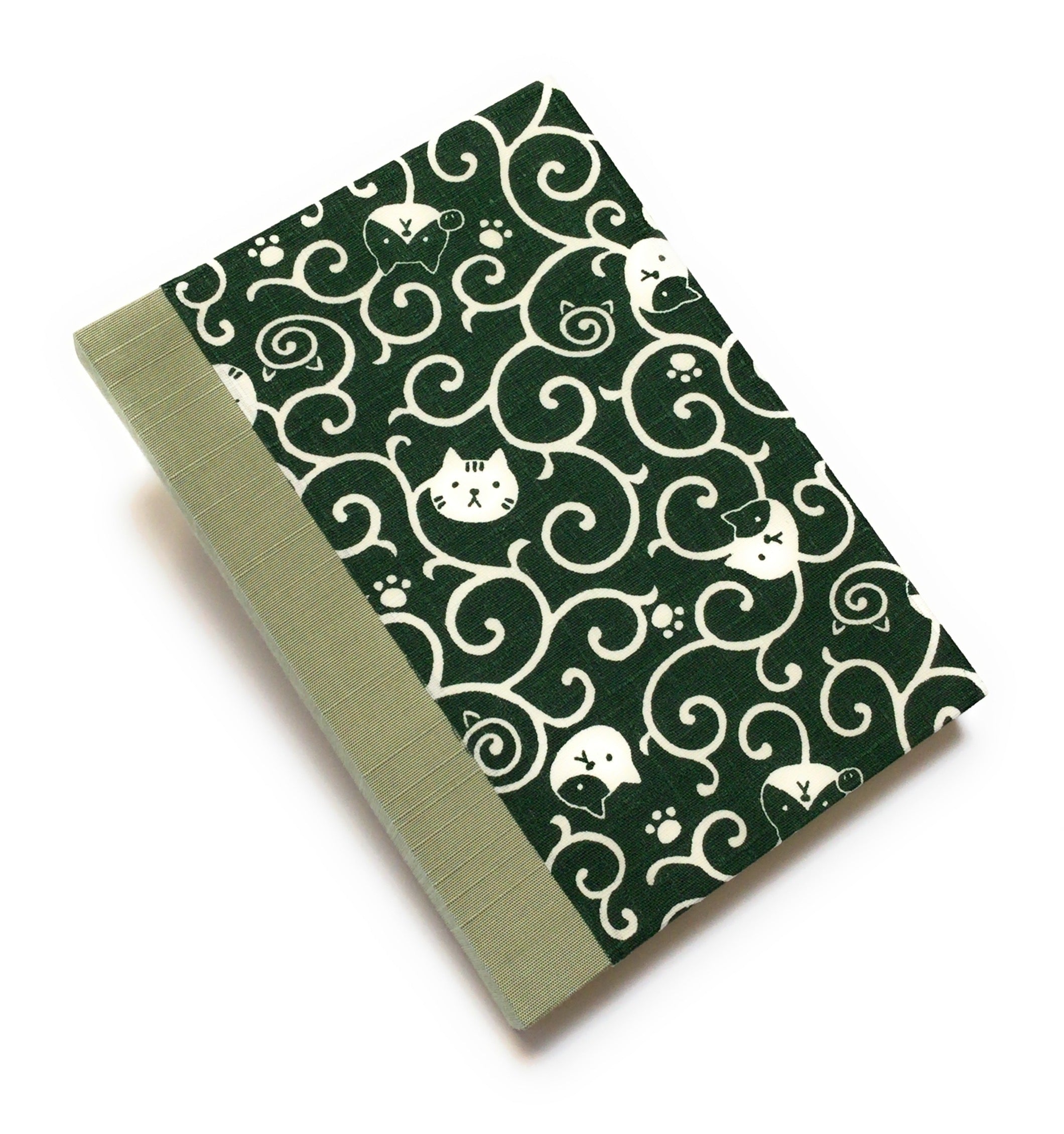 This handcrafted journal features a deep green fabric cover adorned with playful cat illustrations and swirling patterns. Bound with a sage green bookbinding cloth, it is perfect for journaling, sketching, or note-taking, making it a great gift for cat lovers.