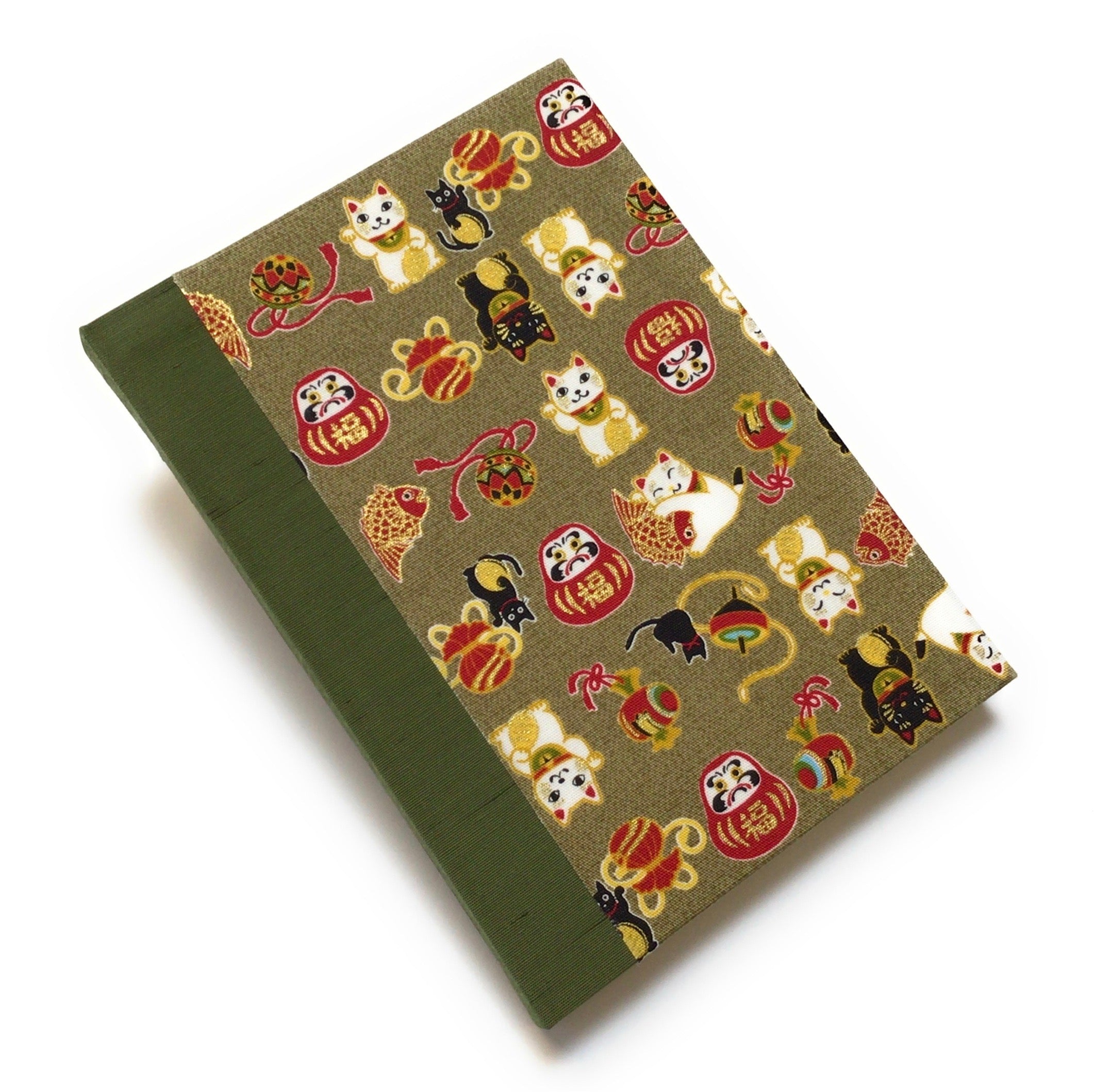This beautifully handcrafted journal features a traditional Japanese Maneki Neko (lucky cat) and Daruma doll pattern on a high-quality fabric cover, symbolizing prosperity and good fortune. Designed for cat lovers, writers, and creatives, this unique notebook is perfect for journaling, sketching, or note-taking, making it a meaningful and stylish gift.