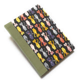 This handmade journal features a charming cat-themed fabric cover with a playful pattern of colorful kittens on a dark background. Designed with high-quality craftsmanship, it’s the perfect notebook for cat lovers, writers, and artists who enjoy capturing their thoughts in a unique and stylish way.