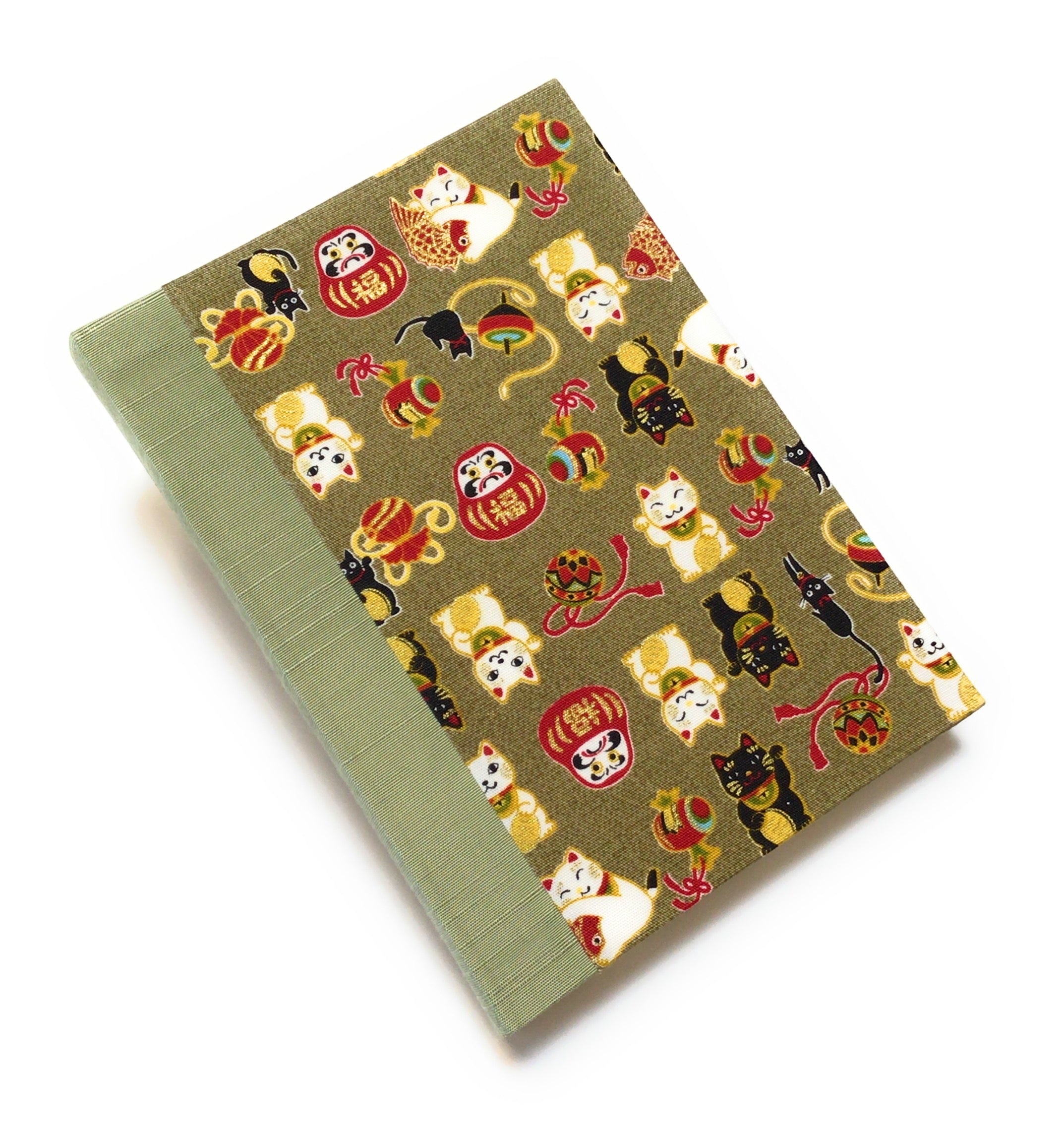 This beautifully handcrafted journal features a traditional Japanese Maneki Neko (lucky cat) and Daruma doll pattern on a high-quality fabric cover, symbolizing prosperity and good fortune. Designed for cat lovers, writers, and creatives, this unique notebook is perfect for journaling, sketching, or note-taking, making it a meaningful and stylish gift.