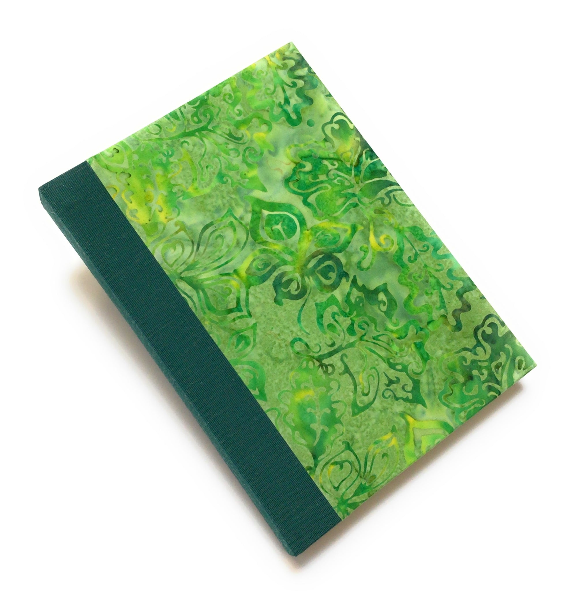 Yellow green tropical flower patterned batik covers. Green Japanese bookcloth spine. 200 blank pages both sides. 5 x 7.