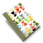 This handcrafted cat journal features a vibrant and playful fabric cover adorned with multicolor feline silhouettes, making it a perfect gift for cat lovers, writers, and artists. Bound with sage green bookcloth and high-quality materials, this unique notebook is ideal for journaling, sketching, or note-taking.