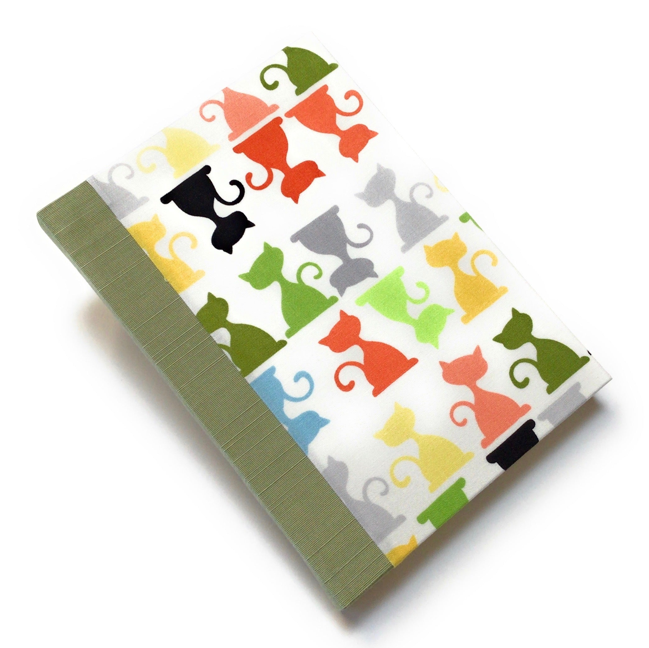 This handcrafted cat journal features a vibrant and playful fabric cover adorned with multicolor feline silhouettes, making it a perfect gift for cat lovers, writers, and artists. Bound with sage green bookcloth and high-quality materials, this unique notebook is ideal for journaling, sketching, or note-taking.