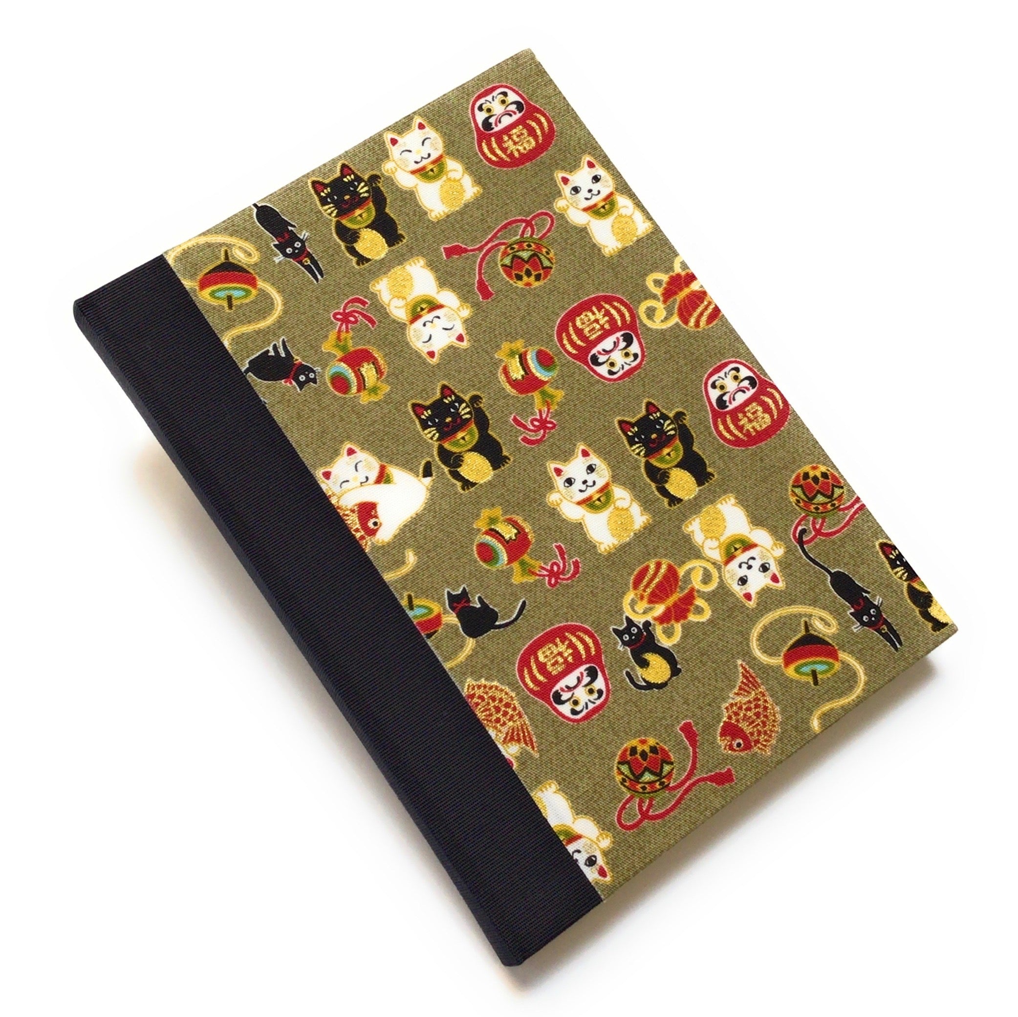 This beautifully handcrafted journal features a traditional Japanese Maneki Neko (lucky cat) and Daruma doll pattern on a high-quality fabric cover, symbolizing prosperity and good fortune. Designed for cat lovers, writers, and creatives, this unique notebook is perfect for journaling, sketching, or note-taking, making it a meaningful and stylish gift.